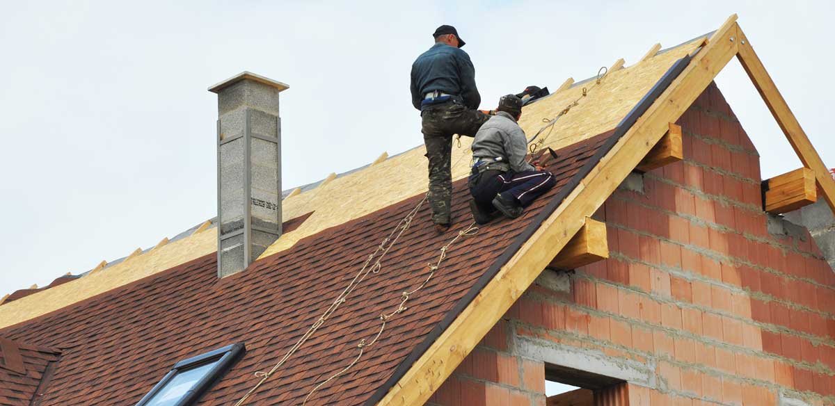 Roofers laying